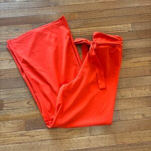Women’s orange wide leg slacks size M.